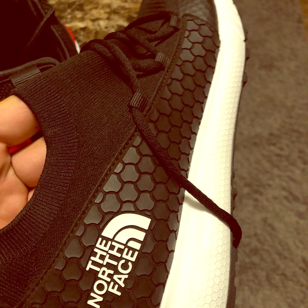 North face and nike shoes pair
